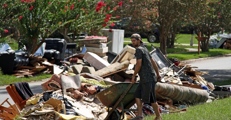 Residents of Baton Rouge piled up damaged belongings during cleanup efforts. (Ken Durden/Shutterstock.com)