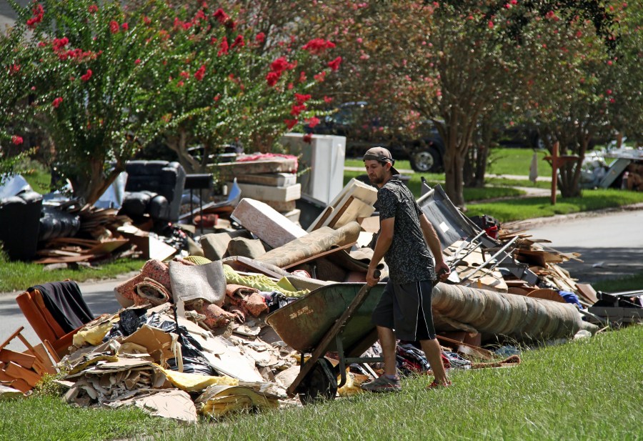 Residents of Baton Rouge piled up damaged belongings during cleanup efforts. (Ken Durden/Shutterstock.com)