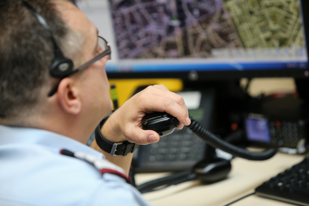 A public safety telecommunicator speaks to a distressed caller.