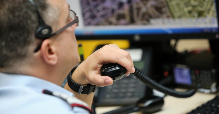 A public safety telecommunicator speaks to a distressed caller.