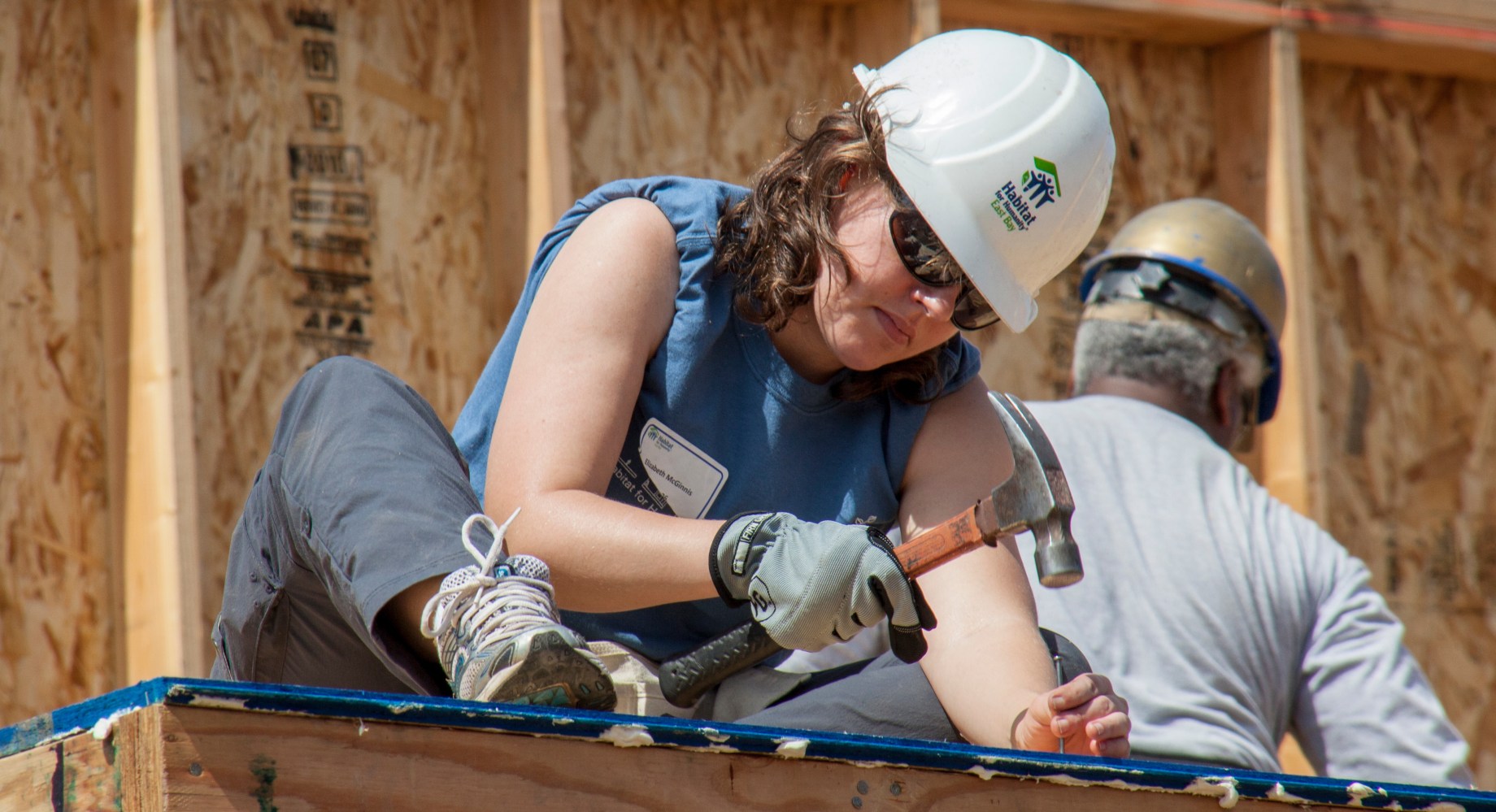 A roofer works on a home for Habitat for Humanity.