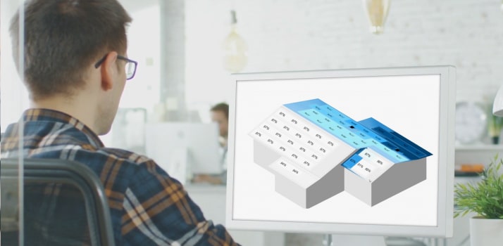 man looking at roof design in laptop
