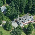 aerial view of single family home in forest