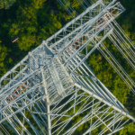Aerial view of high voltage electricity tower over mountain